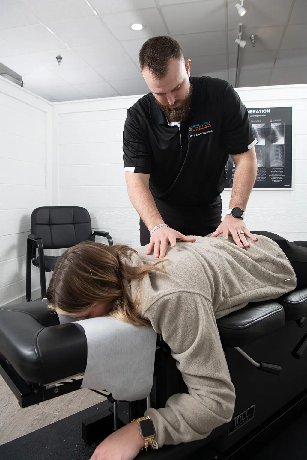 Dr. Chapman making an adjustment at Spine and Joint Chiropractor Office