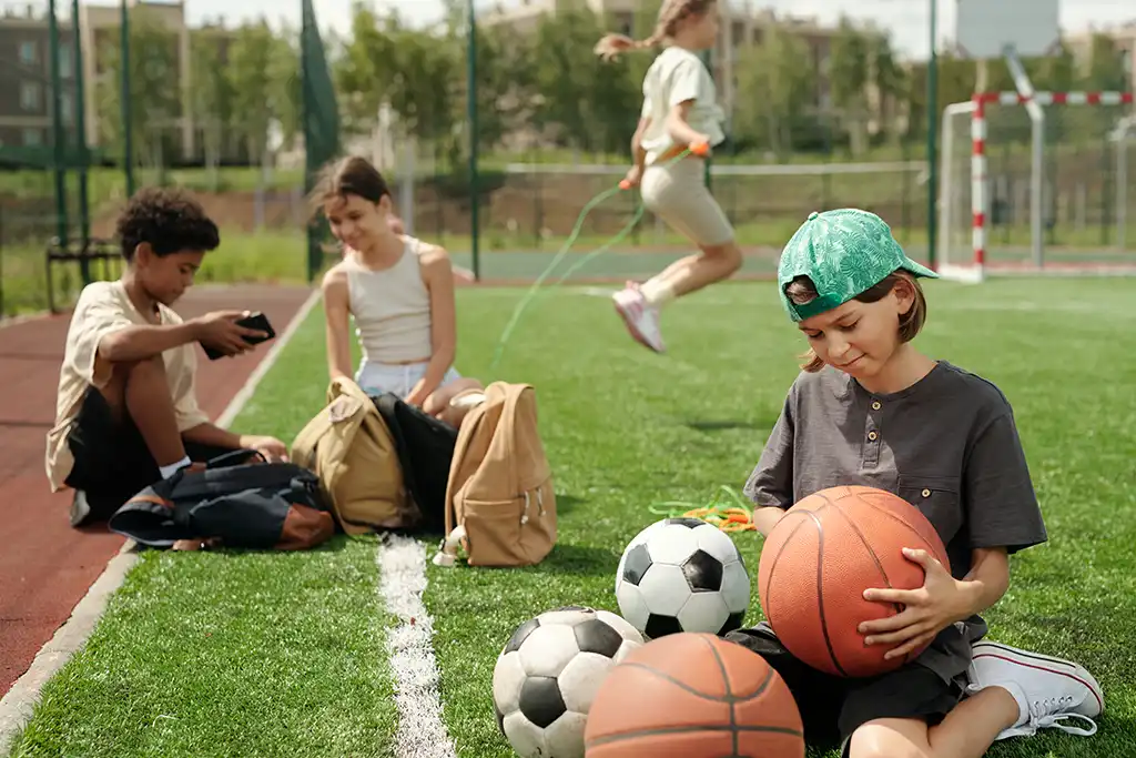 kids playing sports on a field
