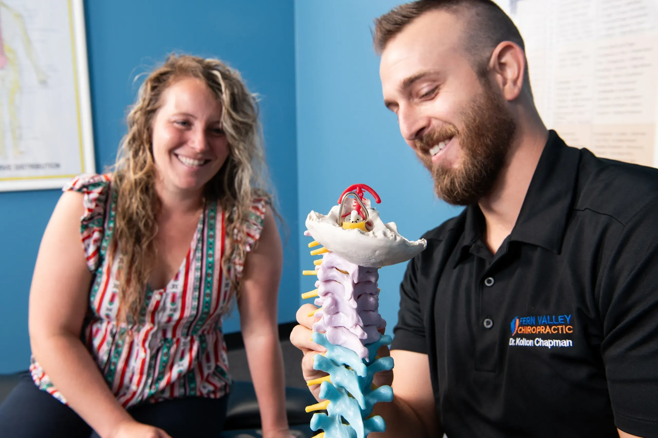 Dr explaining things to patient at Spine & Joint Chiropractic